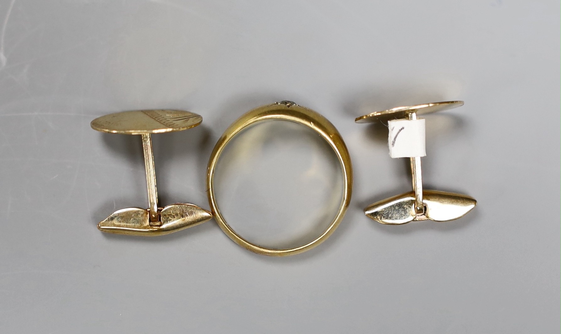 A pair of gold coloured metal cufflinks (tests as 9ct), 3 grams, and a diamond set 18ct gold ring, size N, gross 5.1 grams